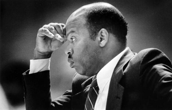 Atlanta City Councilman John Lewis listens during a council meeting in this undated photo from the 1980s. In 1982, observers wondered how Lewis would balance his ideals with the constant deal-making of the city council. (Rich Addicks / AJC Archive at GSU Library AJCP452-146s)