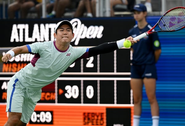 Yoshihito Nishioka (Mie, Japan) stretches to return the ball to Arthur Rinderknech (Gassin, France) during a semifinal match at the 2024 Atlanta Tennis Open at Atlantic Station on Saturday, July 27, 2024 in Atlanta. (Hyosub Shin / AJC)