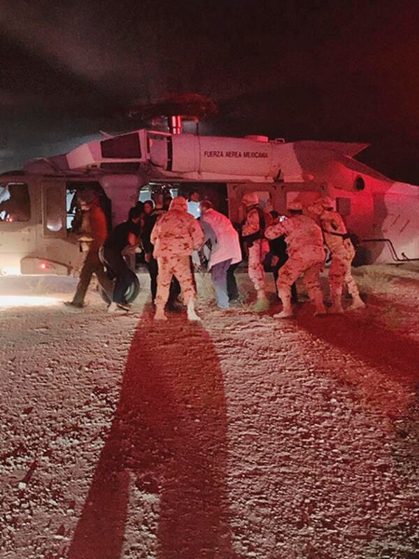 Children of the extended LeBaron family, who were injured in an ambush, are taken aboard a Mexican Airforce helicopter to be flown to the Mexico-U.S. border.