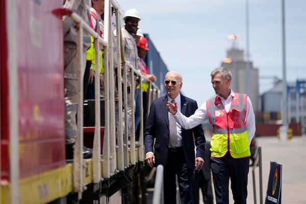 President Joe Biden and Chief Operating Officer of Lobito Atlantic Railway Nicolas Gregoire tour the Lobito Port Terminal in Lobito, Angola, on Wednesday, Dec. 4, 2024. (AP Photo/Ben Curtis)