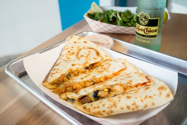  Chicken quesadilla with black bean corn salsa, Yumbii Korean BBQ sauce, and shredded cheese. Photo credit- Mia Yakel.