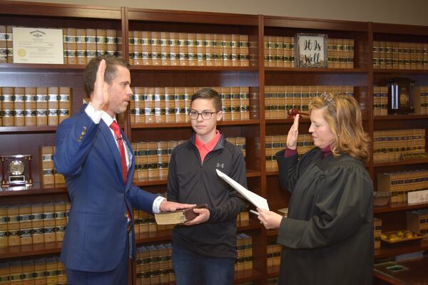 Henry Probate Judge Kelley Powell swears in Commissioner Derrell "Dee" Anglyn.