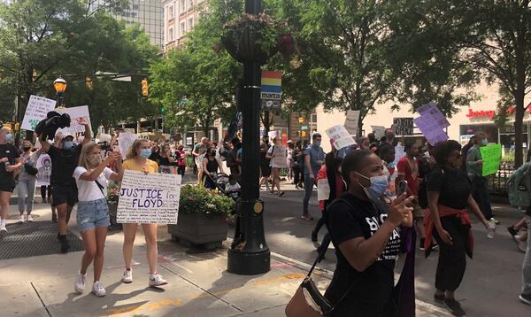 Thousands march in a peaceful protest from Centennial Olympic Park in Atlanta to the Georgia State Capitol Friday afternoon.