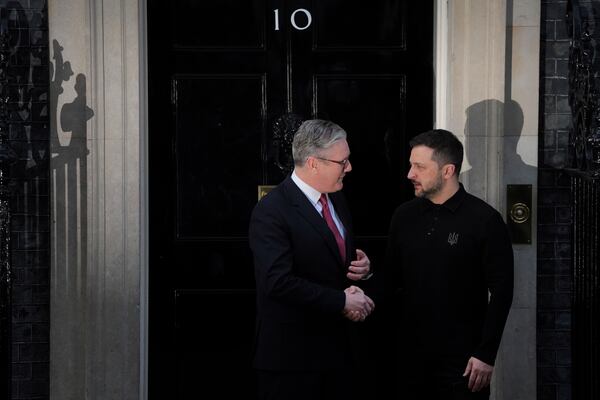 Britain's Prime Minister Keir Starmer, left, greets Ukraine's President Volodymyr Zelenskyy on the doorstep of 10 Downing Street in London Saturday, March 1, 2025. (AP Photo/Kin Cheung)