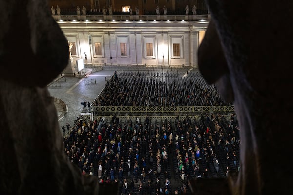 FILE - Catholic faithful attend a nightly rosary prayer service for the health of Pope Francis in St. Peter's Square at the Vatican. (AP Photo/Mosa'ab Elshamy, File)