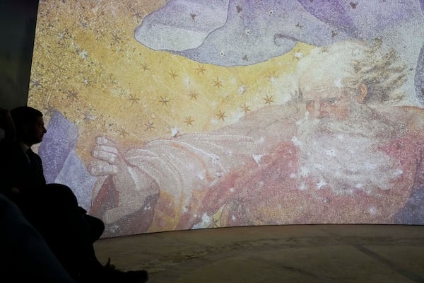 Images of St. Peter's Basilca are projected on a screen during the preview to the press of the exhibition 'Petros eni', which is part of the project "St. Peter's Basilica: AI-Enhanced Experience" at the Vatican, Saturday, Nov. 9, 2024. (AP Photo/Gregorio Borgia)