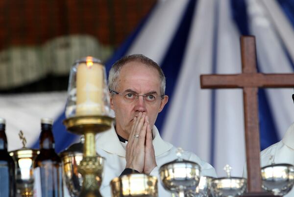 FILE - Britain's Archbishop of Canterbury, Justin Welby conducts a church service with Anglicans in Harare, Zimbabwe, Sunday, April, 17, 2016. (AP Photo/Tsvangirayi Mukwazhi, File)