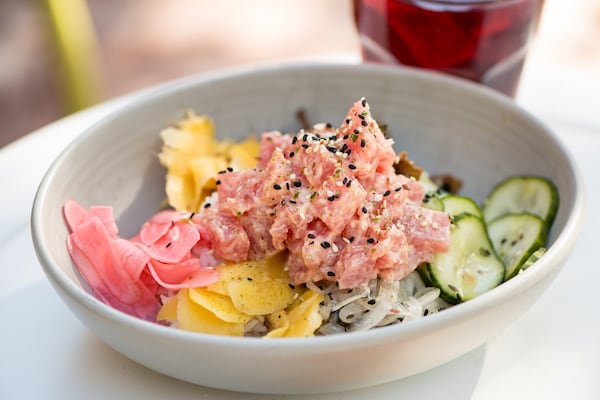 Muchacho Tuna Poke with tuna, sticky rice, Kewpie Sriracha, pickled vegetables, and Wakame salad. Photo credit- Mia Yakel. (The Atlanta Journal-Constitution)