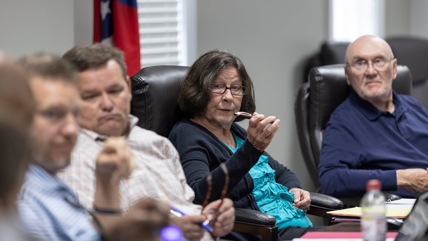 Mary Ellen Anton (center) chaired the meeting as the Morgan County board of assessors voted to approve the Rivian tax exemption proposal in Madison on Wednesday, May 25, 2022.  John Artz (right) opposed it.   (Bob Andres / robert.andres@ajc.com)