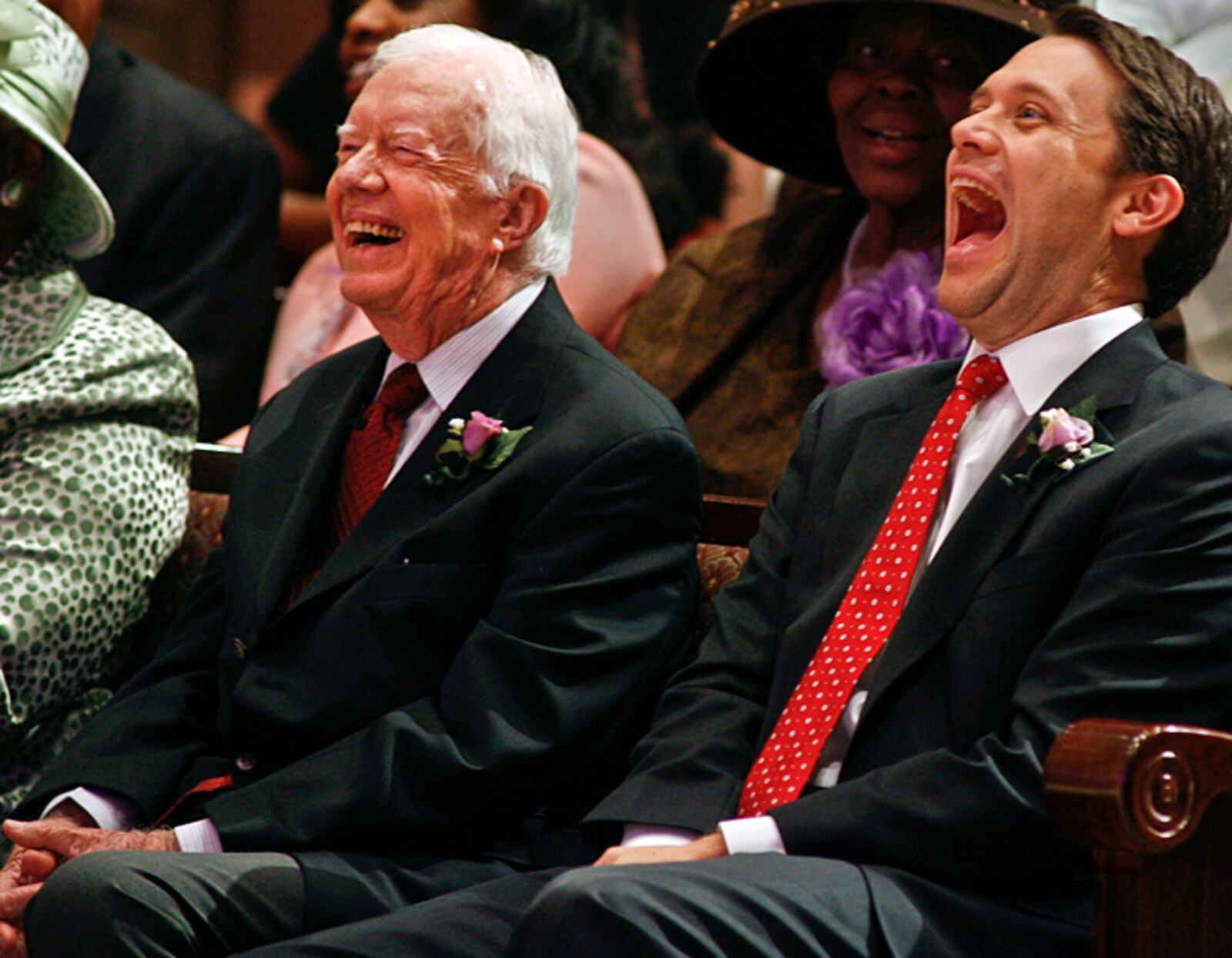 Former President Jimmy Carter, left, and his grandson, Jason       Carter, react to a joke from the pulpit Oct. 12, 2014 at Mt. Zion       Baptist Church in Albany, Ga. Jason Carter is now the chairman of       the Carter Center’s Board of Trustees. “I don’t have any doubt       that Jason can take over when I am gone and do an adequate job,”       Carter said.  (AP Photo/Phil Sears)