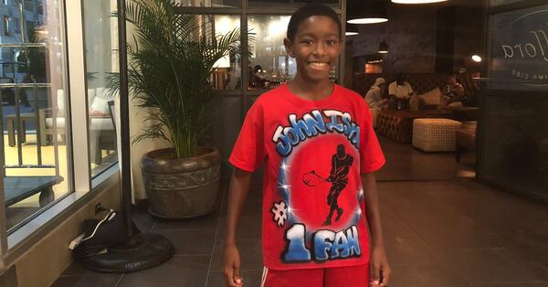 Justin Roberts, 11, is a big fan of John Isner, a former Georgia Bulldogs tennis player. He and his mom attended the BB&T Atlanta Open on July 25, 2018  to cheer on their favorite player. Isner was fresh off his semifinals appearance in Wimbledon. (Photo by Tess DeMeyer/ AJC)