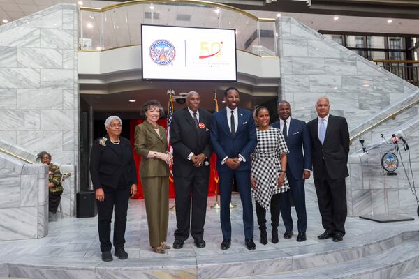 Atlanta Mayor Andre Dickens, center, stands with former Atlanta Mayors Shirley Franklin, left, Keisha Lance Bottoms, third from right, Kasim Reed, second from right, Bill Campbell, right, Valerie Jackson, second from left, and Rev. Gerald Durley during the celebration commemorating the 50th anniversary of the inauguration of Mayor Maynard Jackson at the Atlanta City Hall Atrium, Monday, January 8, 2024, in Atlanta. Valerie Jackson is the widow of Maynard Jackson. (Jason Getz / Jason.Getz@ajc.com)