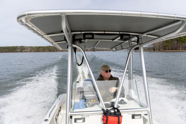 Putnam County Sheriff Howard Sills steers a boat on Lake Oconee in Eatonton on Thursday, February 13, 2025. The Putnam County sheriff is investigating and volunteers are searching after Spelman College instructor Joycelyn Nicole Wilson and an Atlanta private school coach Gary Jones went missing on Lake Oconee over the weekend. The body of Wilson was found Sunday and Jones has not been found.(Arvin Temkar / AJC)