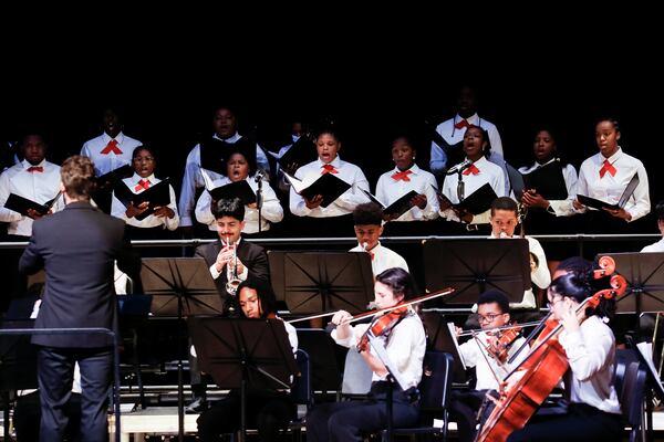 Logan Souther conducts the Atlanta Music Project's youth orchestra and choir during a concert from May 2023. Photos: Quinn West Photography