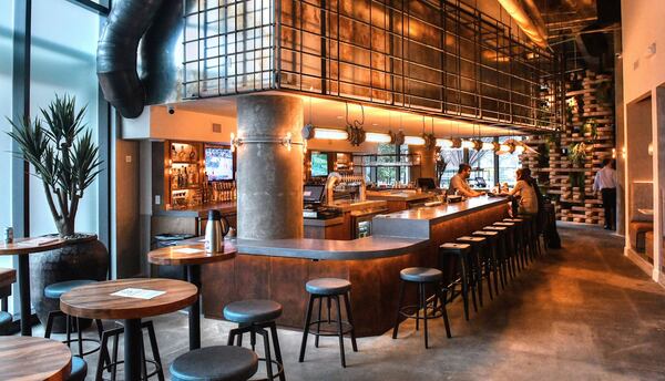 The bar area features rebar and repurposed industrial lighting.  CONTRIBUTED BY CHRIS HUNT PHOTOGRAPHY