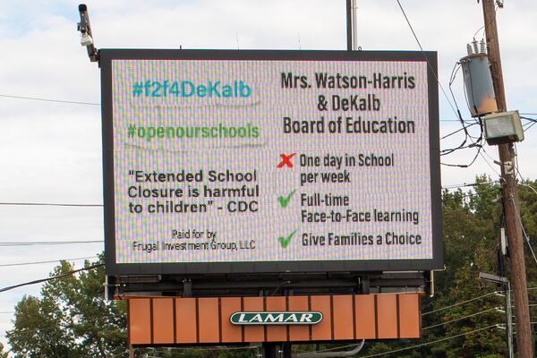 A billboard calling on DeKalb school distict leaders to offer a more robust in-person learning option, paid for by a group of DeKalb County parents, is seen on DeKalb Industrial Way in Decatur, Georgia, on Oct. 16, 2020. (Rebecca Wright for the Atlanta Journal-Constitution)