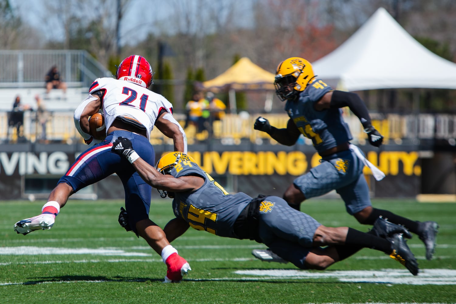 Quali Conley of Dixie State runs the ball. CHRISTINA MATACOTTA FOR THE ATLANTA JOURNAL-CONSTITUTION.