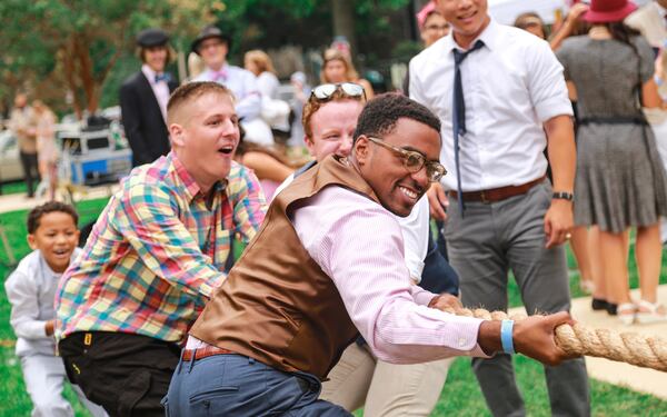 Great Gatsby Lawn Party attendees play a game of tug-o-war. Photo by: Nishell Falcone