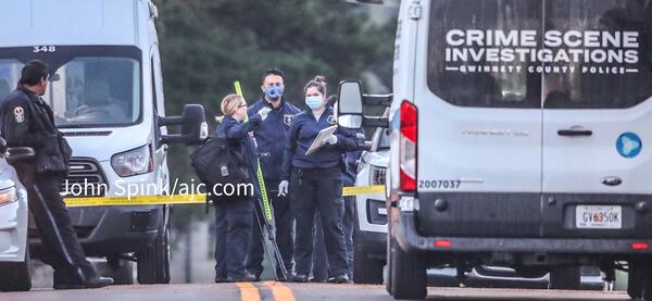 Homicide detectives and crime scene investigators are working to gather evidence at the scene of a fatal shooting on Rabbit Hill Road.