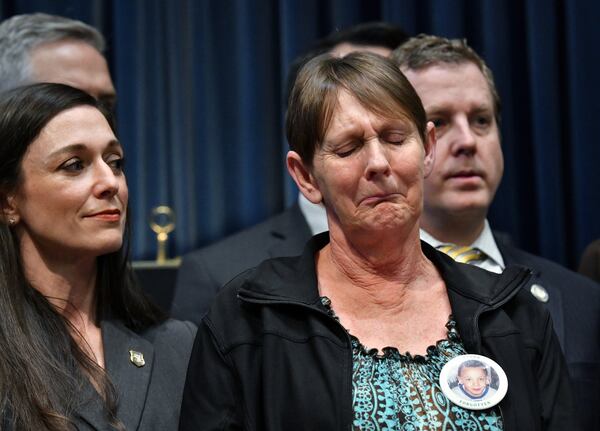 Deborah Rider, who lost her son in drive-by shooting, reacts as Gov. Brian Kemp (not pictured) introduces anti-gang bills during a press conference at the Georgia State Capitol building in Atlanta on Thursday, January 30, 2020. (Hyosub Shin / Hyosub.Shin@ajc.com)