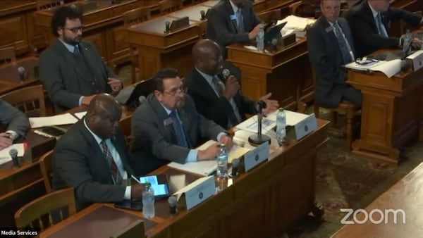 During hearings with the Georgia Senate study committee, GDC Commissioner Tyrone Oliver (center, with microphone) repeatedly described critical news articles as propaganda. Sitting with Oliver is Chief of Staff Alan Watson (in glasses) and Assistant Commissioner of Facilities Ahmed Holt (bottom left). (Georgia Senate)