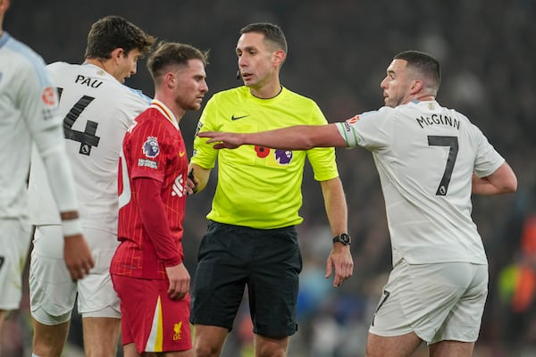 Referee David Coote officiates during the English Premier League soccer match between Liverpool and Aston Villa at the Anfield stadium in Liverpool, Saturday, Nov. 9, 2024. (AP Photo/Jon Super)