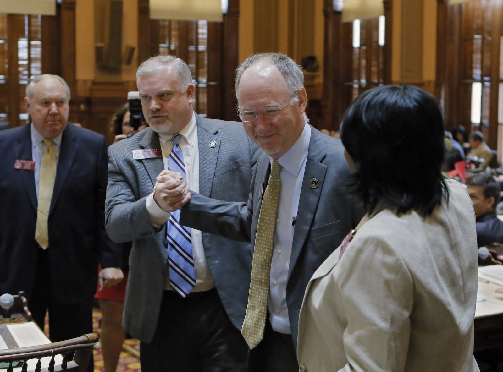 Mar. 28, 2017 - Atlanta - Rep. Allen Peake, R - Macon, is congratulated after the House passed SB 16, which would expand the list of disorders eligible for treatment under the state’s nascent medical marijuana program. The chamber voted 167-4 on Tuesday to adopt the bill. The 39th legislative day of the 2017 General Assembly. BOB ANDRES /BANDRES@AJC.COM