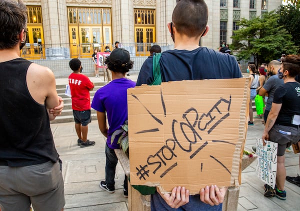 Demonstrators in support of defunding the police and a socialist democracy gather on the steps of Atlanta City Hall on Sunday, Aug 15, 2021 in opposition to a $90 million proposed police training facility that will be built on 381 acres of green space known as Old Atlanta Prison Farm.  (Jenni Girtman for The Atlanta Journal Constitution)