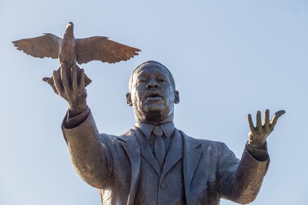 City of Atlanta unveils the bronze statue "Hope Moving Forward" honoring the life and legacy of Dr. Martin Luther King Jr. on Friday, January 15, 2021 near the intersection of Northside Drive and MLK Jr Drive.  This is the first of seven art installations commissioned by the city to honor MLK.  (Jenni Girtman for The Atlanta Journal Constitution)