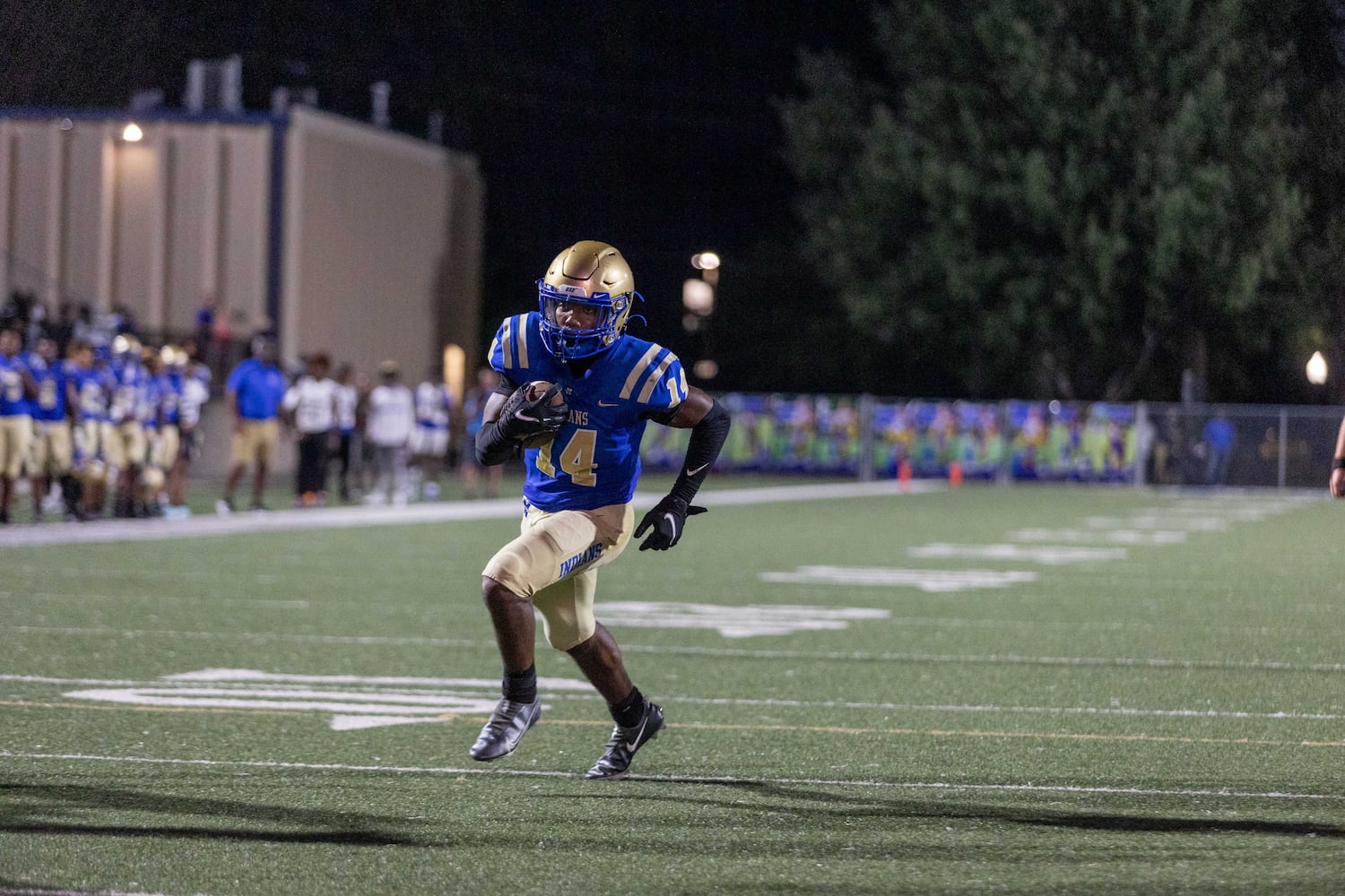 McEachern's Jaden Barnes (14) runs the ball for a touchdown during a GHSA High School football game between Langston Hughes High School and McEachern High School at McEachern High School in Powder Springs, GA., on Friday, August 26, 2022. (Photo by Jenn Finch)