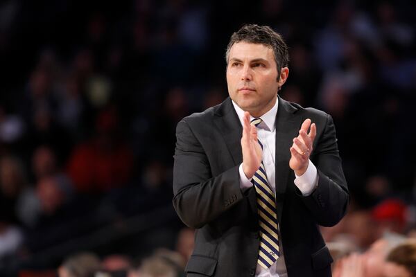 Georgia Tech Yellow Jackets head coach Josh Pastner applaud his team during their game against the Georgia Bulldogs at McCamish Pavilion, Tuesday, December 6, 2022, in Atlanta. Georgia Tech Yellow Jackets won 79-77. (Jason Getz / Jason.Getz@ajc.com)