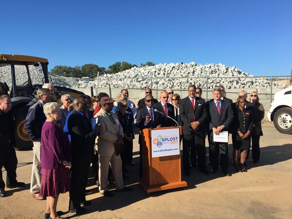 DeKalb County CEO Mike Thurmond, surrounded by mayors and government officials, speaks about ballot measures to increase sales taxes and cut property taxes during a press conference at the DeKalb Roads and Drainage Division on Wednesday, Oct. 18, 2017. MARK NIESSE / MARK.NIESSE@AJC.COM