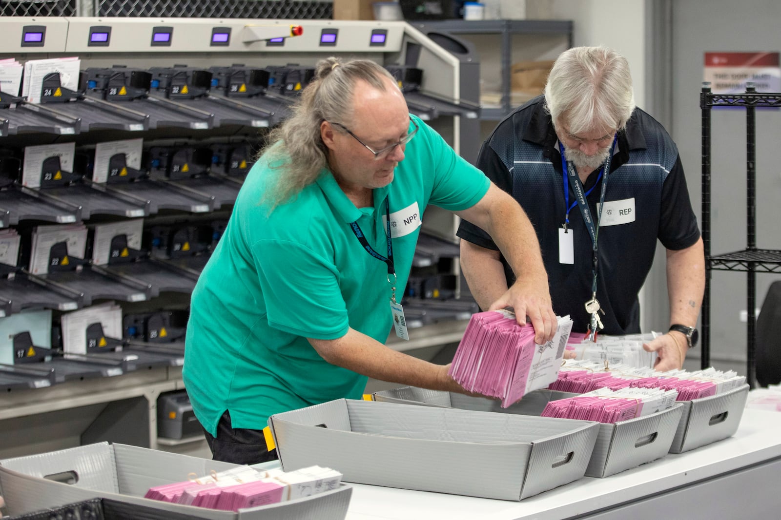 Washoe County election workers sort ballots at the Registrar of Voters Office in Reno, Nev., on Tuesday, Oct. 29, 2024. (AP Photo/Tom R. Smedes)