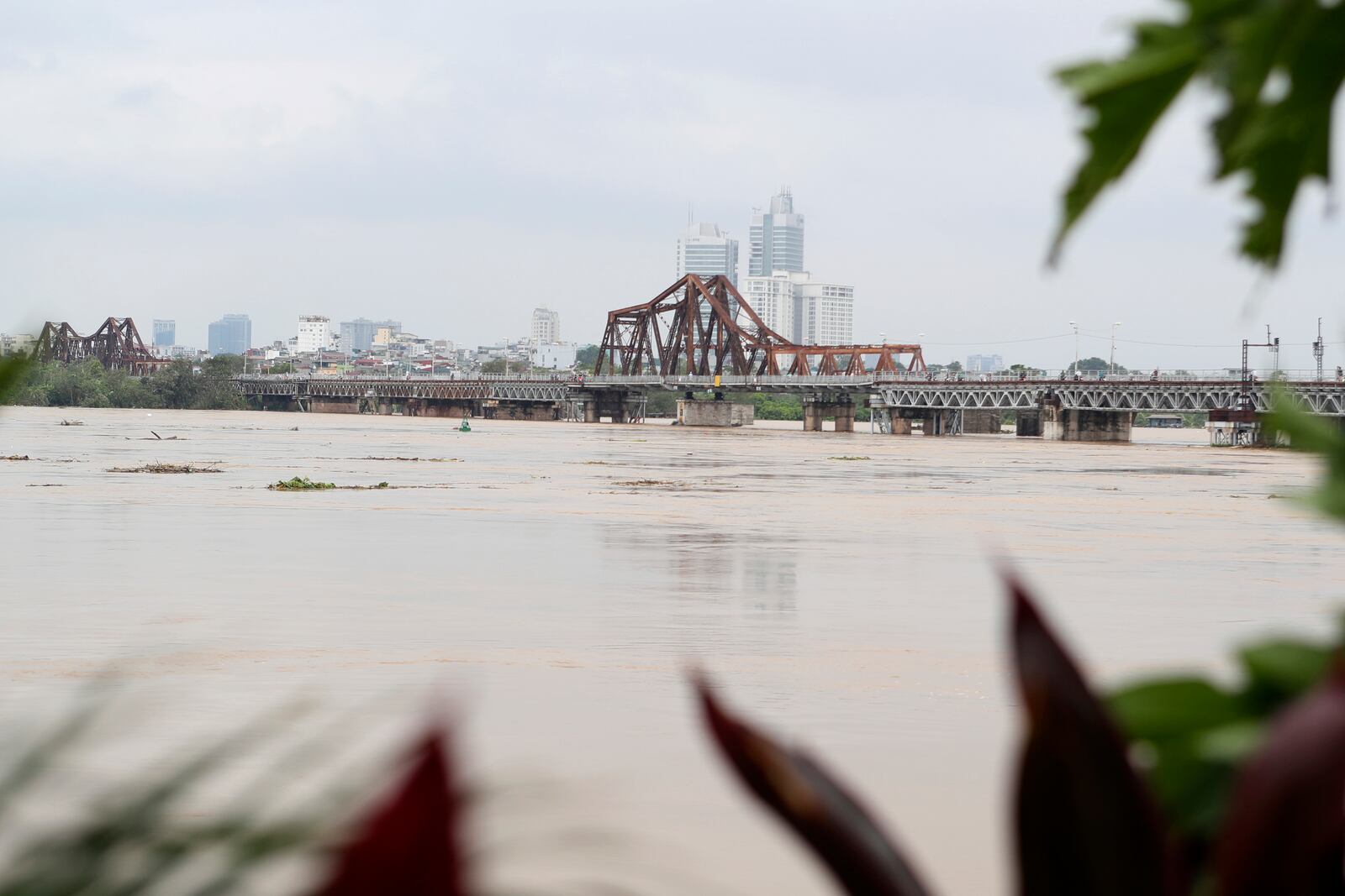 The iconic Long Bien bridge is seen on flooded Red river, following Typhoon Yagi in Hanoi, Vietnam on Tuesday, Sept. 10, 2024. (AP Photo/Huy Han)