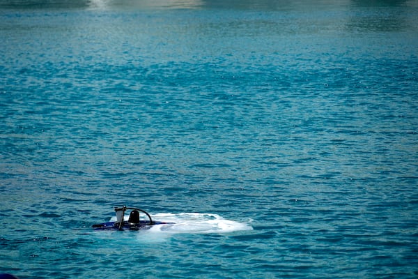 An underwater drone passes inside the seawater during a demonstration at a Marina in the southern resort of Ayia Napa, Cyprus, Monday, Feb. 24, 2025. (AP Photo/Petros Karadjias)