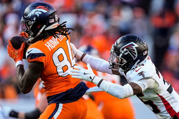 Denver Broncos wide receiver Lil'Jordan Humphrey (84) makes the catch against Atlanta Falcons cornerback Natrone Brooks (35) during the second half of an NFL football game, Sunday, Nov. 17, 2024, in Denver. (AP Photo/David Zalubowski)