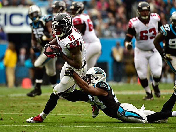 Falcons wide receiver Julio Jones with the ball as Panthers cornerback Josh Norman defends. (Bob Donnan/USA Today Sports)