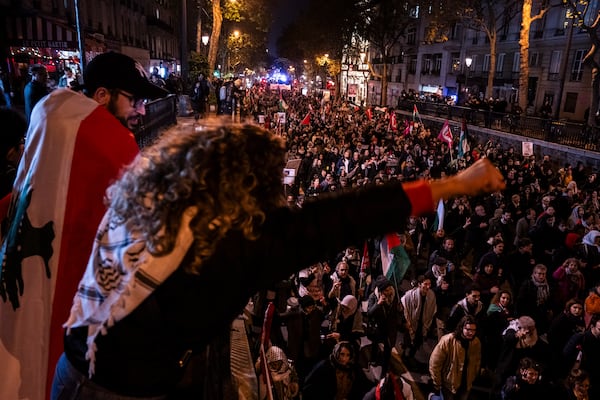 Protestors take part in a rally against the "Israel is Forever" gala organized by far-right Franco-Israeli figures, in Paris, Wednesday, Nov. 13, 2024, on the eve of the Nations League 2025 soccer match between France and Israel. (AP Photo/Louise Delmotte)