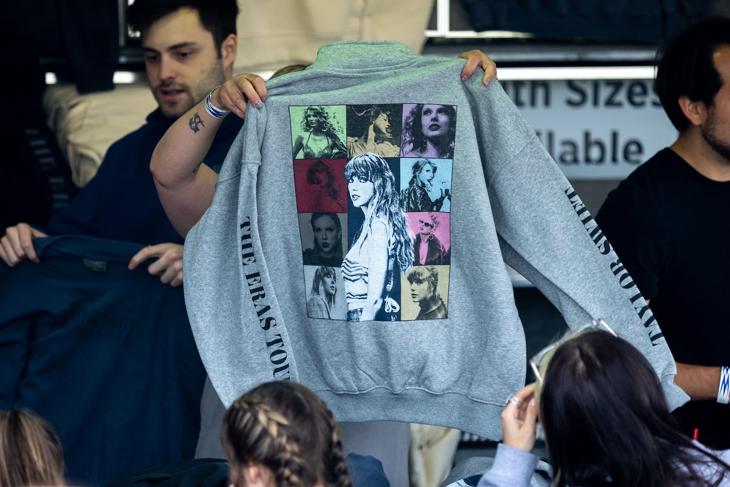 Taylor Swift Fans, Weather features, and Merchandise-selling Vendors.