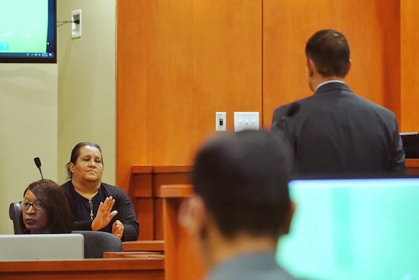 Witness Araceli Vega interacts with a lawyer for the prosecution while on the witness stand during day three of the Robert Olson murder trial at the DeKalb County Courthouse on October 1, 2019 in Decatur. (Elijah Nouvelage for The Atlanta Journal-Constitution)