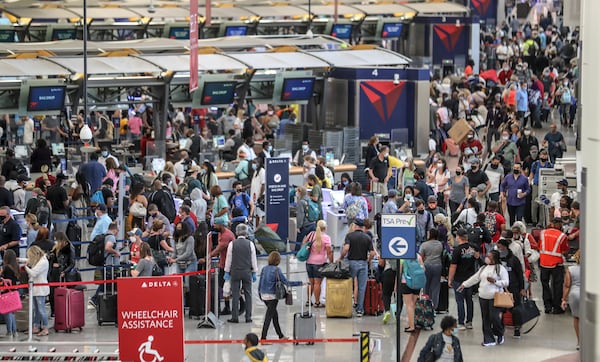 May 27, 2021 Hartsfield-Jackson International Airport: The Delta ticket counters were swarmed as crowds have returned to AtlantaÕs Hartsfield-Jackson International Airport for the Memorial Day weekend travel period as seen on Thursday, May 27, 2021.  (John Spink / John.Spink@ajc.com)

