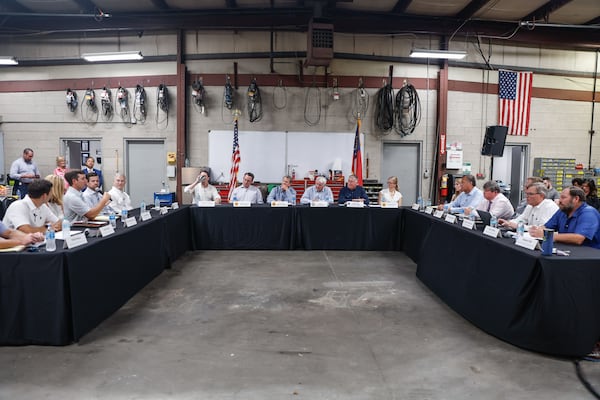 Gov. Brian Kemp, state lawmakers and small business leaders participate in a roundtable discussion on civil litigation policies impacting the state's business climate at Samson Tours headquarters in Atlanta on Thursday, Aug. 22, 2024. (Natrice Miller/ AJC)