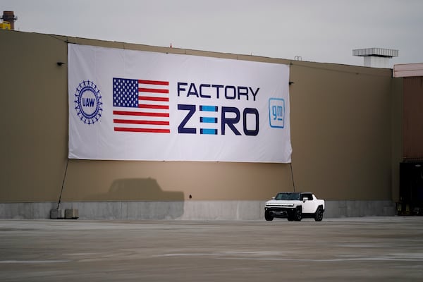 FILE - President Joe Biden test drives a Hummer at the General Motors Factory ZERO electric vehicle assembly plant during a tour, Nov. 17, 2021, in Detroit. (AP Photo/Evan Vucci, File)