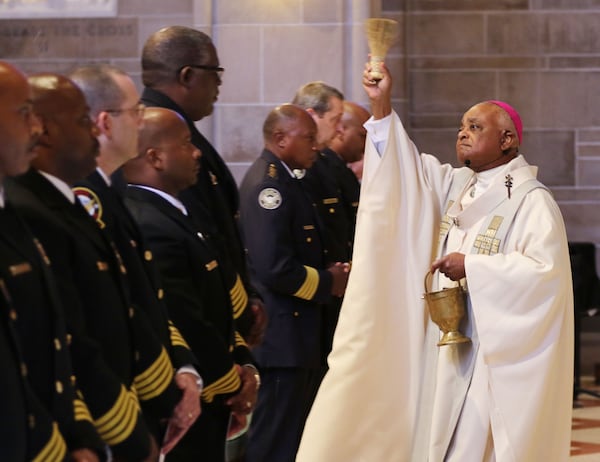 Wilton Gregory, right, served as the archbishop of Atlanta before he headed to Washington, D.C. (BOB ANDRES  / BANDRES@AJC.COM)