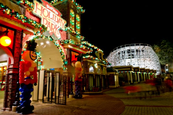 Visitors exit Six Flags Over Georgia in Austell on Friday, November 21, 2014. The park has been decorated in 10 sections of holiday lights for the first time since 1990. Holiday in the Park runs through Jan.4, 2015. JONATHAN PHILLIPS / SPECIAL