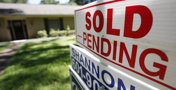 Atlanta saw a surge of buyer interest in homes at the start of the year and the signing of many contracts. (AP Photo/Rogelio V. Solis, File)