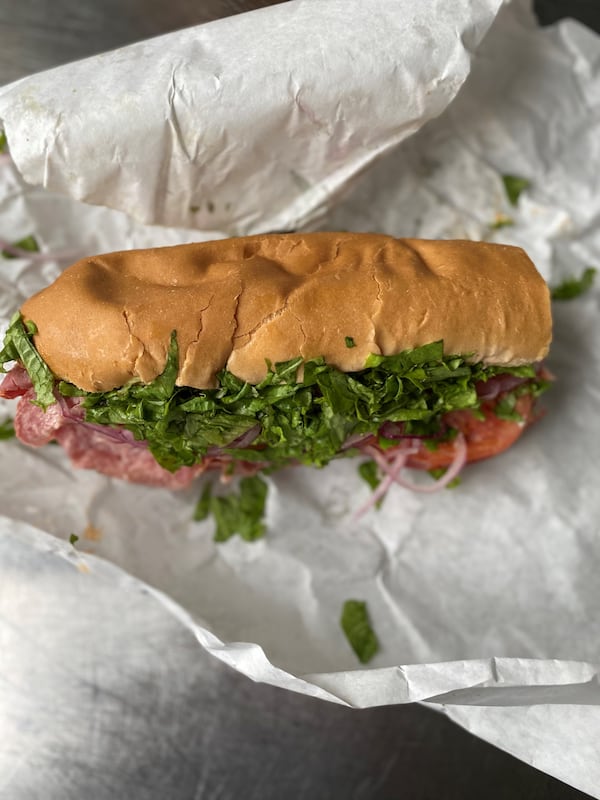 O4W Pizza has added submarine sandwiches to the menu, including the Kitchen Sink, stuffed with ham, capicola, salami, turkey and roast beef. Wendell Brock for The Atlanta Journal-Constitution