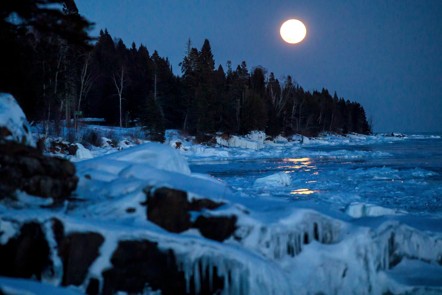 Photos: 'Super snow moon,' largest supermoon of 2019, lights up the sky