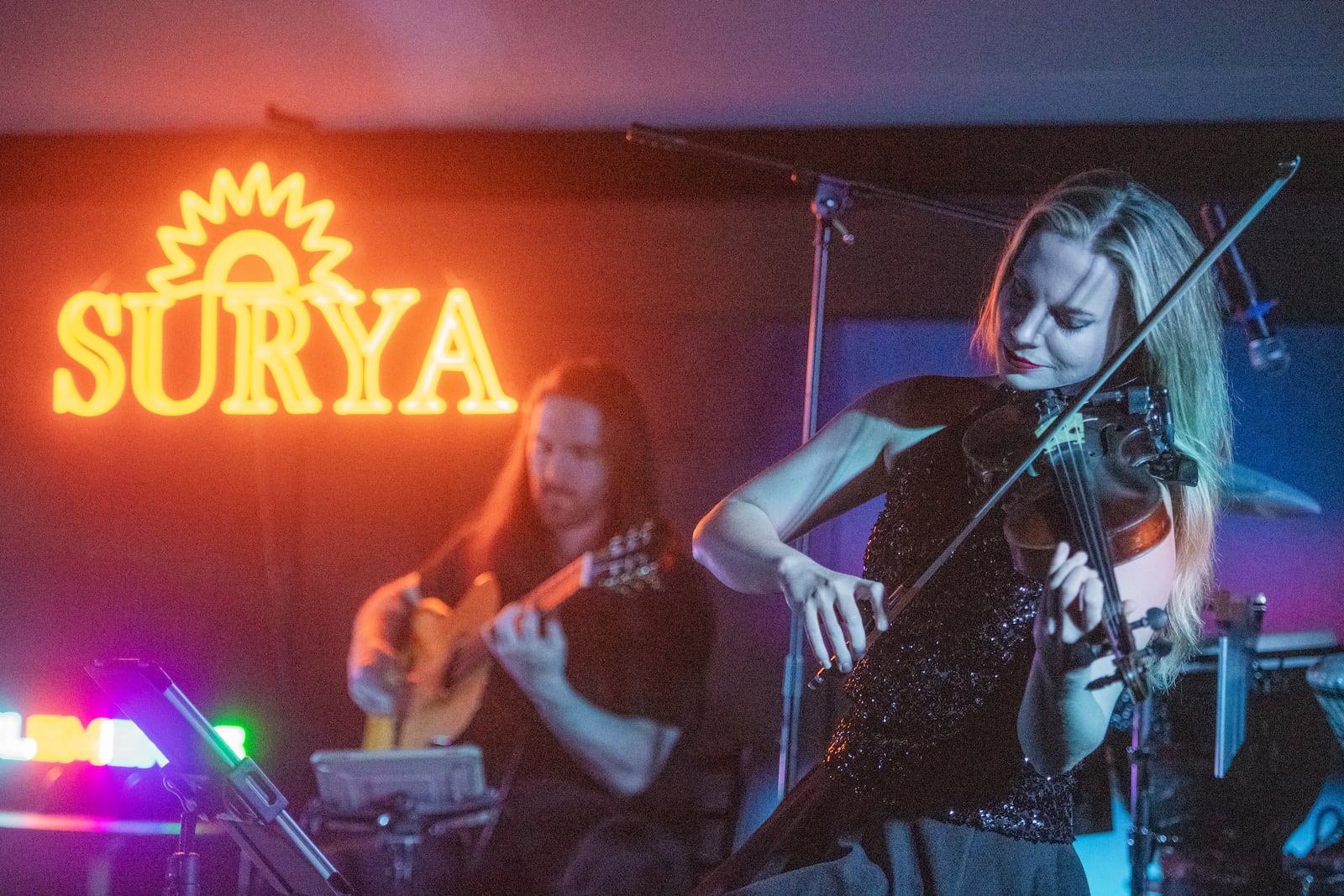 Michelle Winters, (right), plays the violin at a Surya Ensemble concert in Atlanta on Thursday, July 25, 2024.  (Ziyu Julian Zhu / AJC)