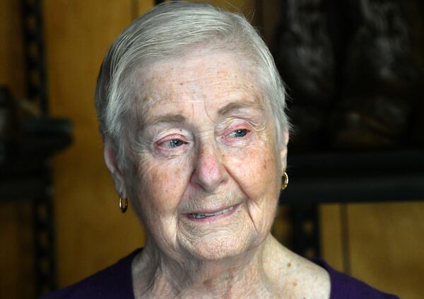 Ruth Moss, widow of Billy Moss, becomes emotional talking about her late husband at Canton Shoe Repair. The couple  was "sweet on each other" since elementary school, she said. (Hyosub Shin / Hyosub.Shin@ajc.com)